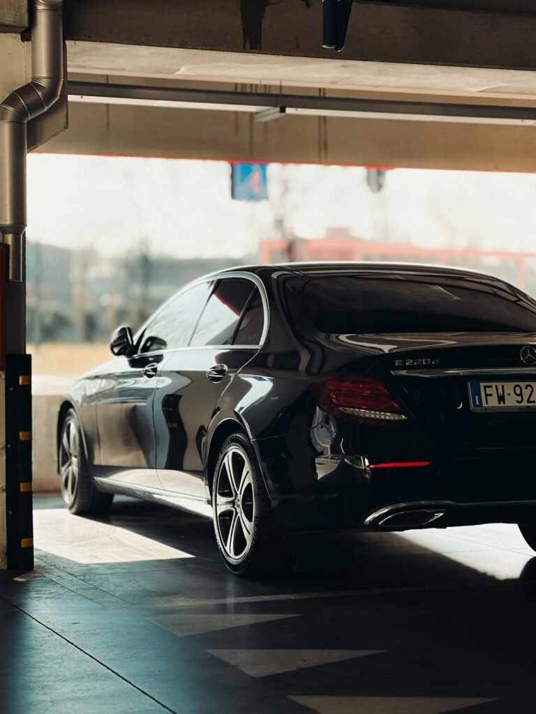 Professional sedan parked in a workshop garage